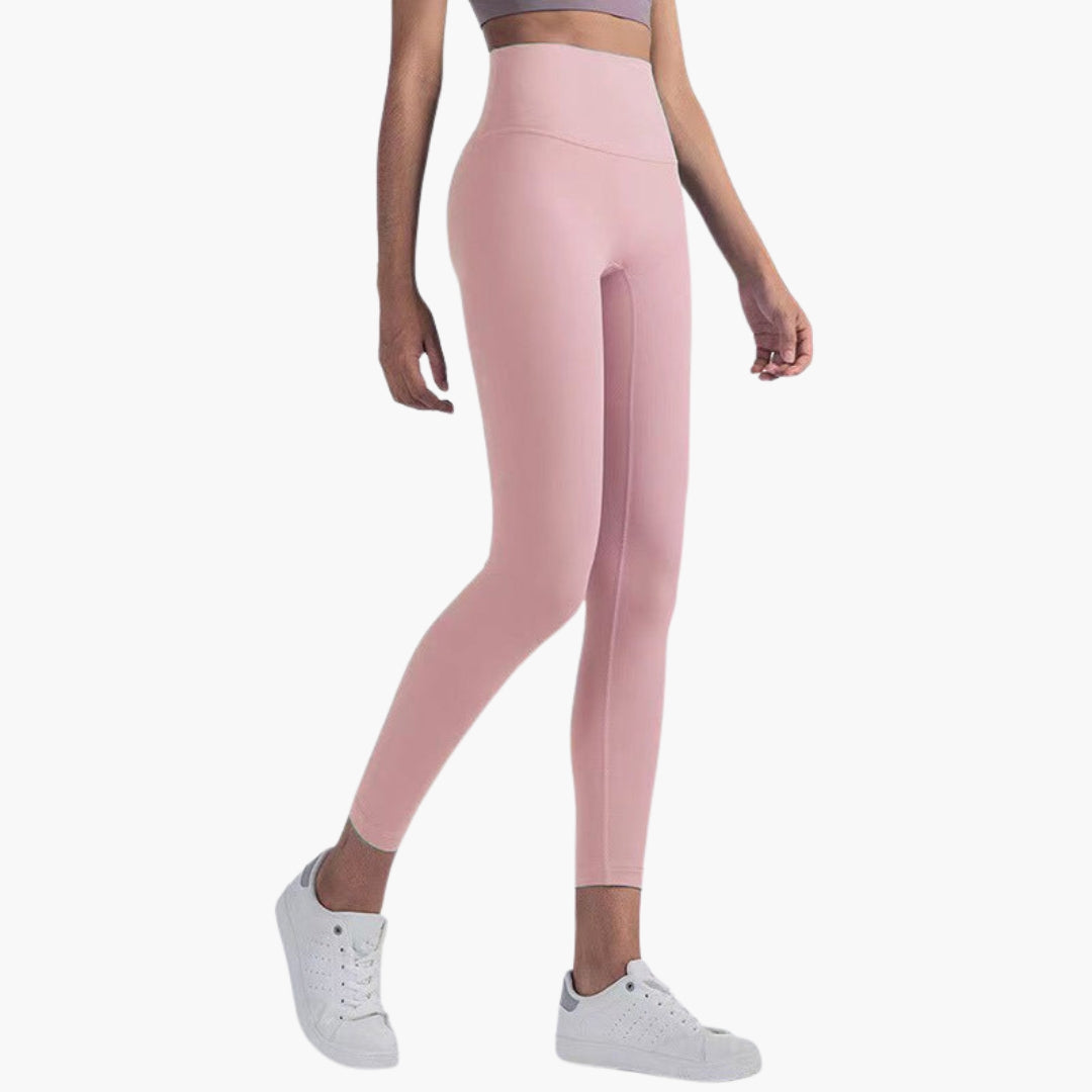 High-waisted women's sports leggings full-length stretch fabric sleek pocketless gym-ready active fit