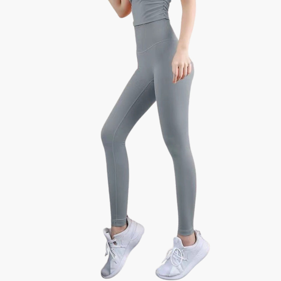 High waisted women's sports leggings full length stretch fabric sleek pocketless gym-ready active fit