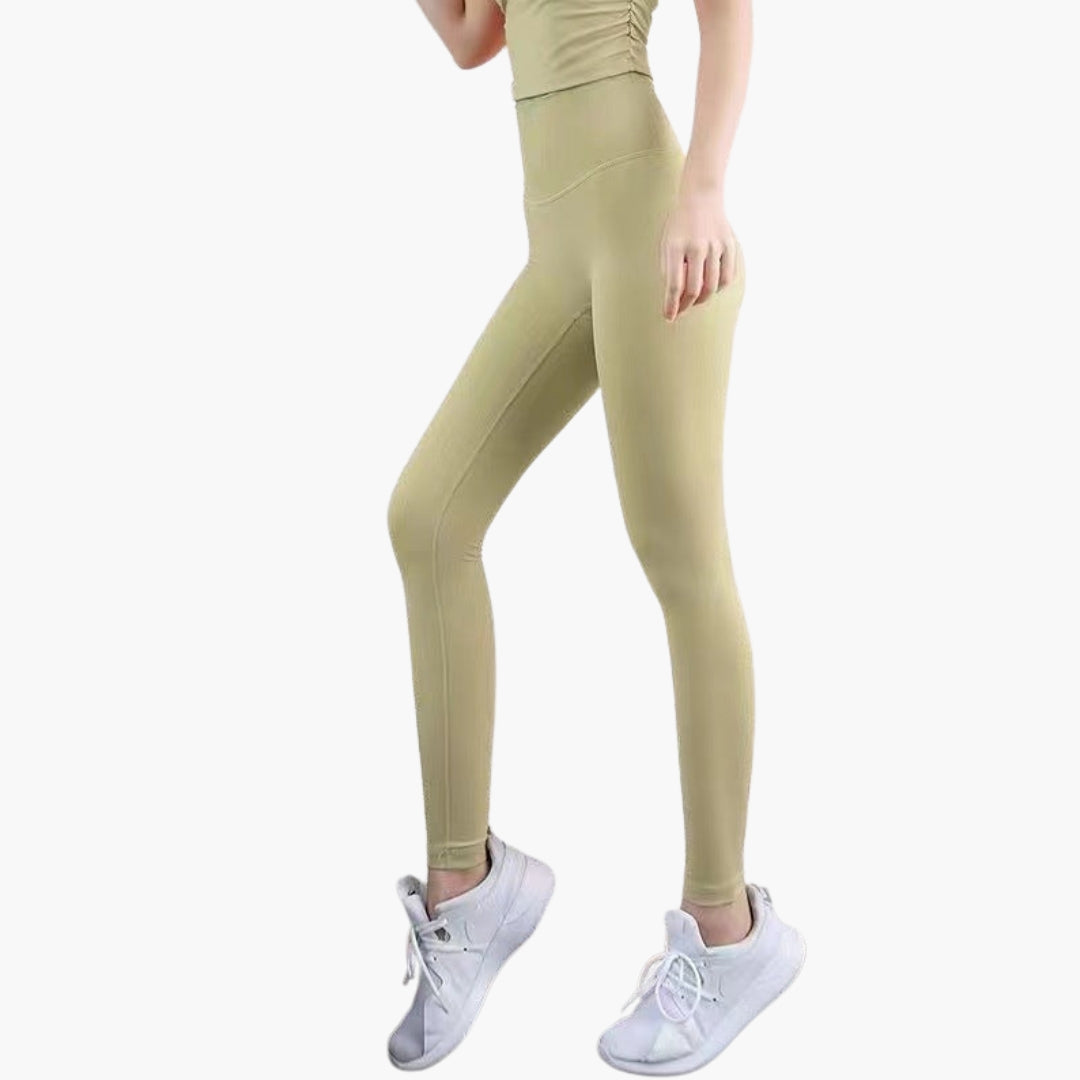 High-waisted women's gym leggings in full-length stretch fabric, sleek pocketless design for active fit