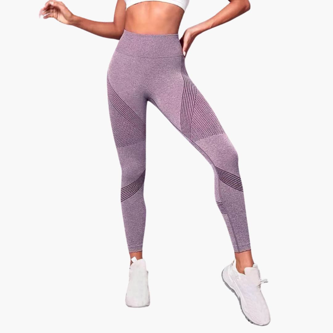 Women's black high-waist seamless gym leggings with breathable mesh panels for training