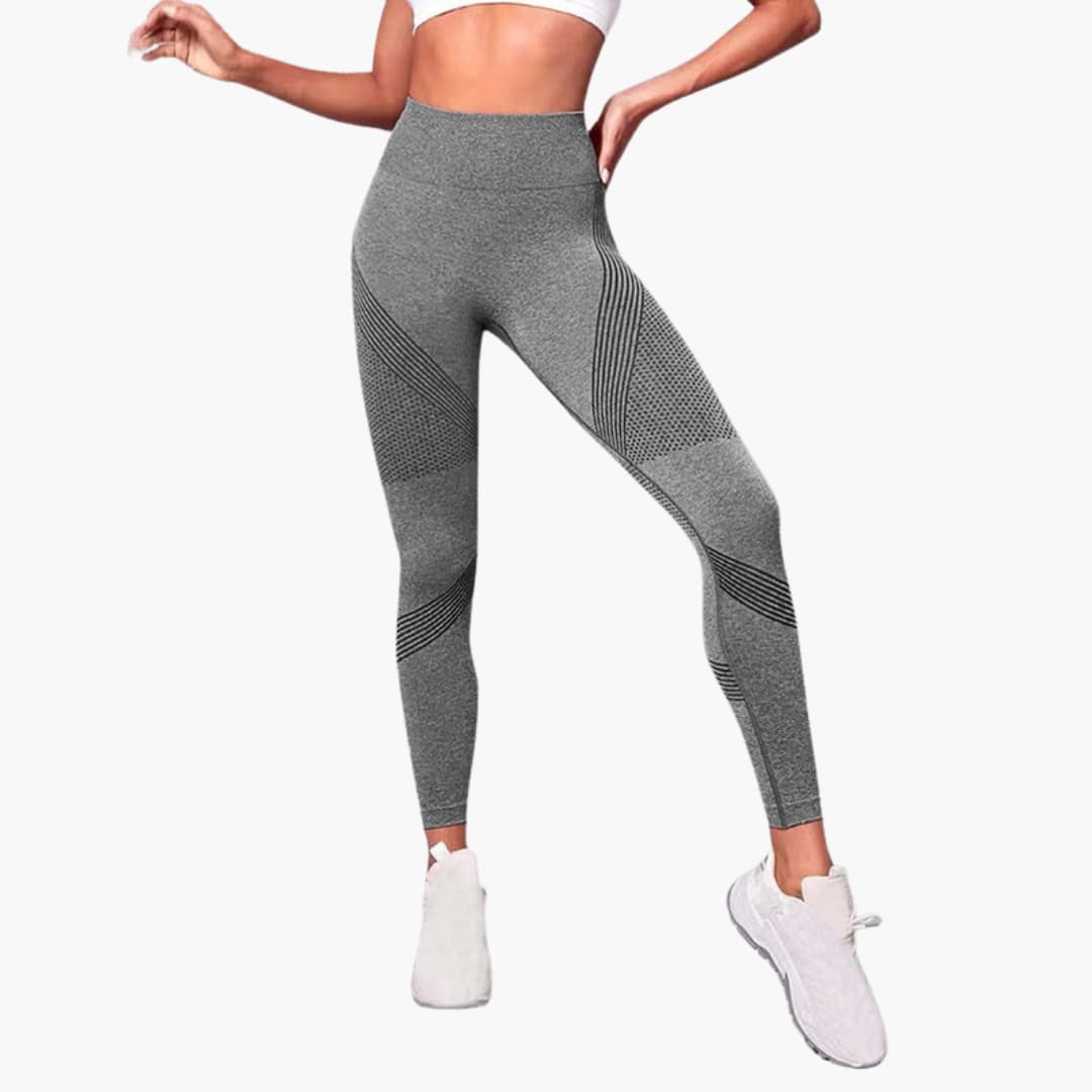 Women's black high-waist seamless sports leggings with breathable mesh panels for gym training