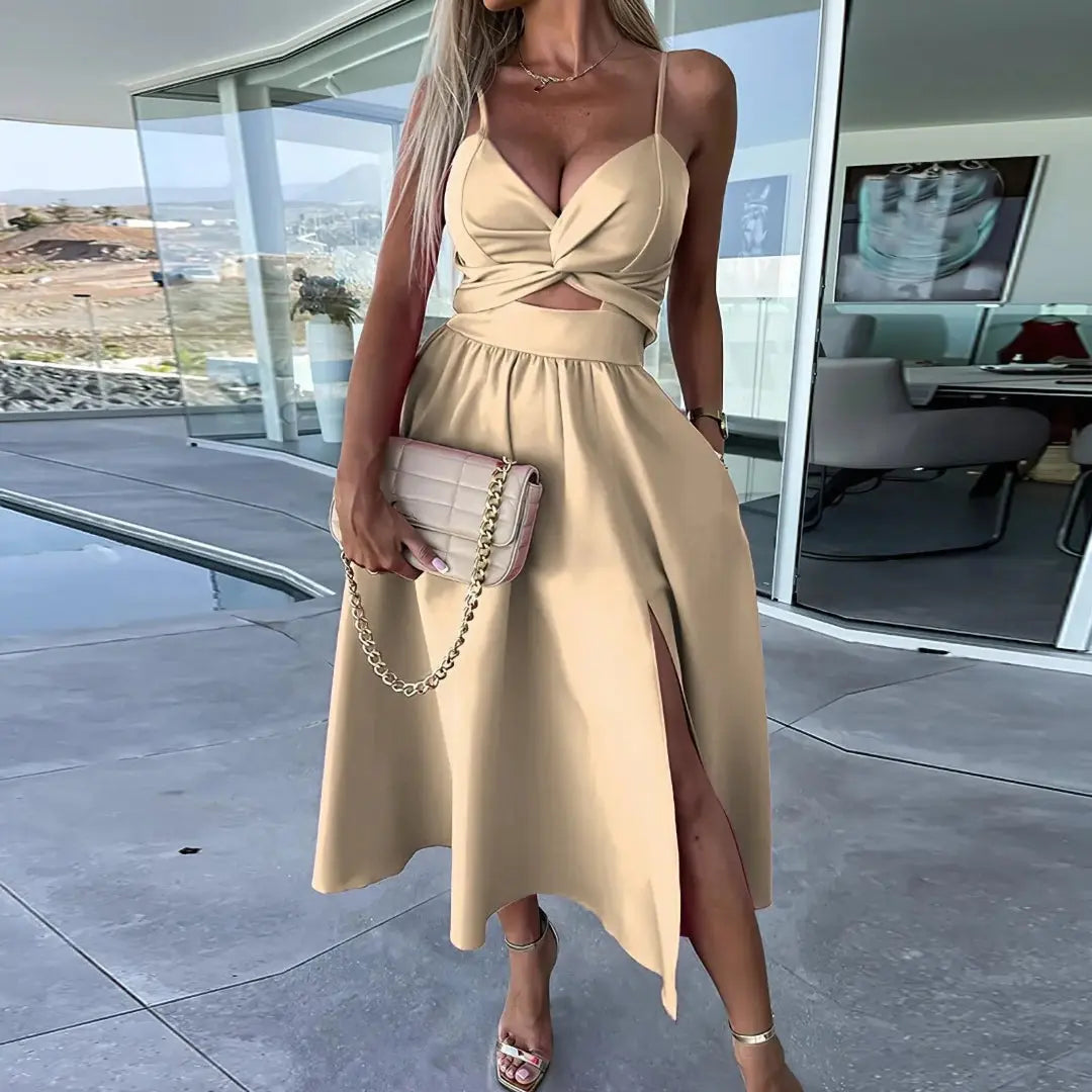 Chic midi dress with twist front bodice, spaghetti straps, cutout midriff, and leg-revealing side slit