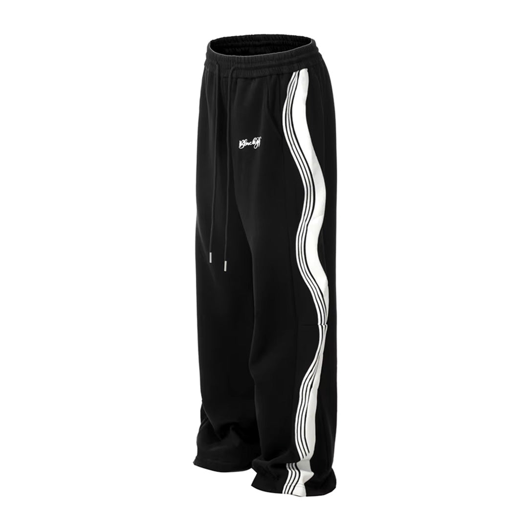 Men's loose fit track pants with wavy side stripe detail in athletic casual style drawstring waist
