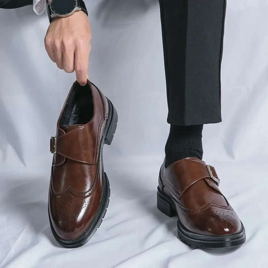 Brown leather Oxford loafers with brogue detailing and monk-strap metal buckle closure