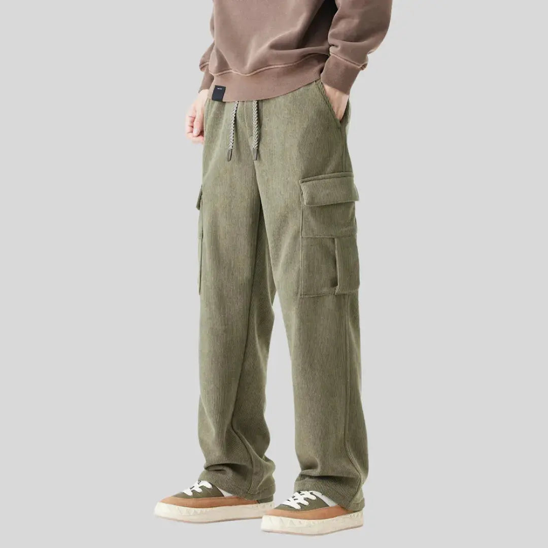 Men's olive tactical corduroy cargo pants with military-inspired cut and multi-pocket rugged design