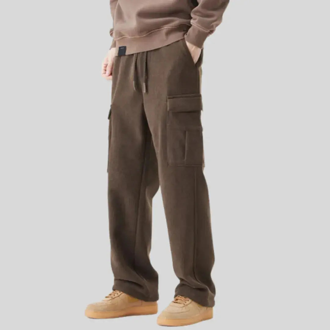 Men's olive tactical corduroy cargo pants with military-inspired cut and multi-pocket rugged design