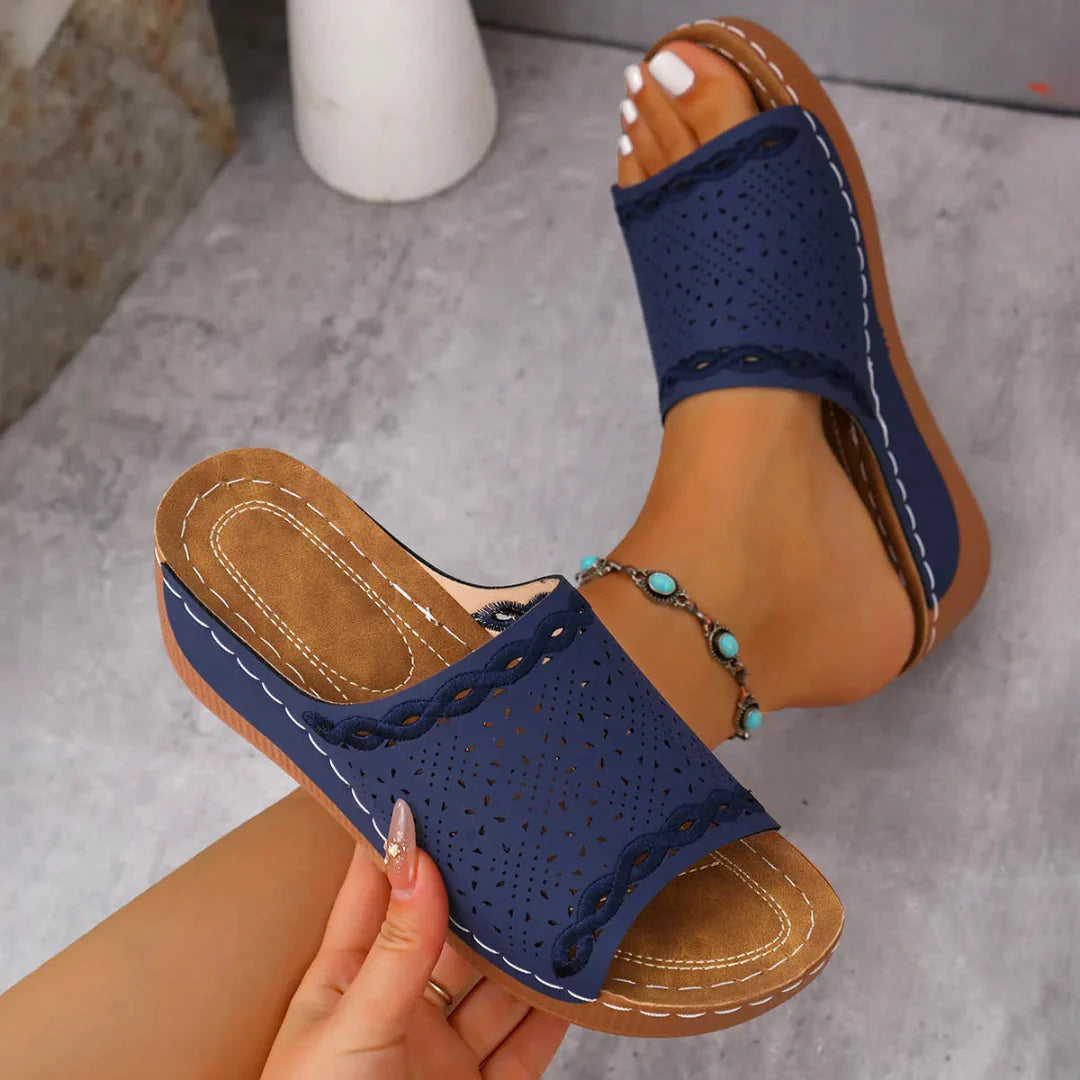 Women's beige perforated wedge slip-on sandals with cushioned sole and open-toe breathable design