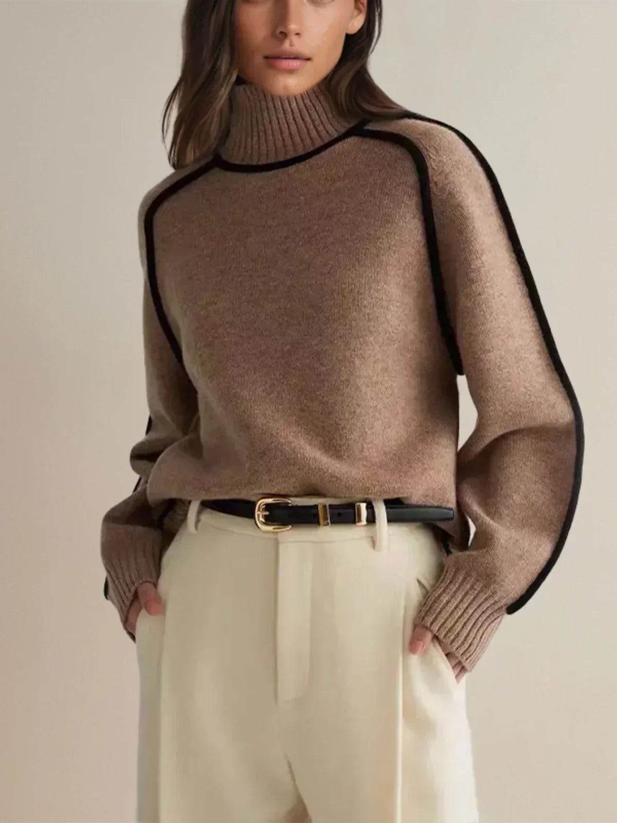 Ivory knit turtleneck sweater with black contrast trim seams, sleek architectural cut for professionals
