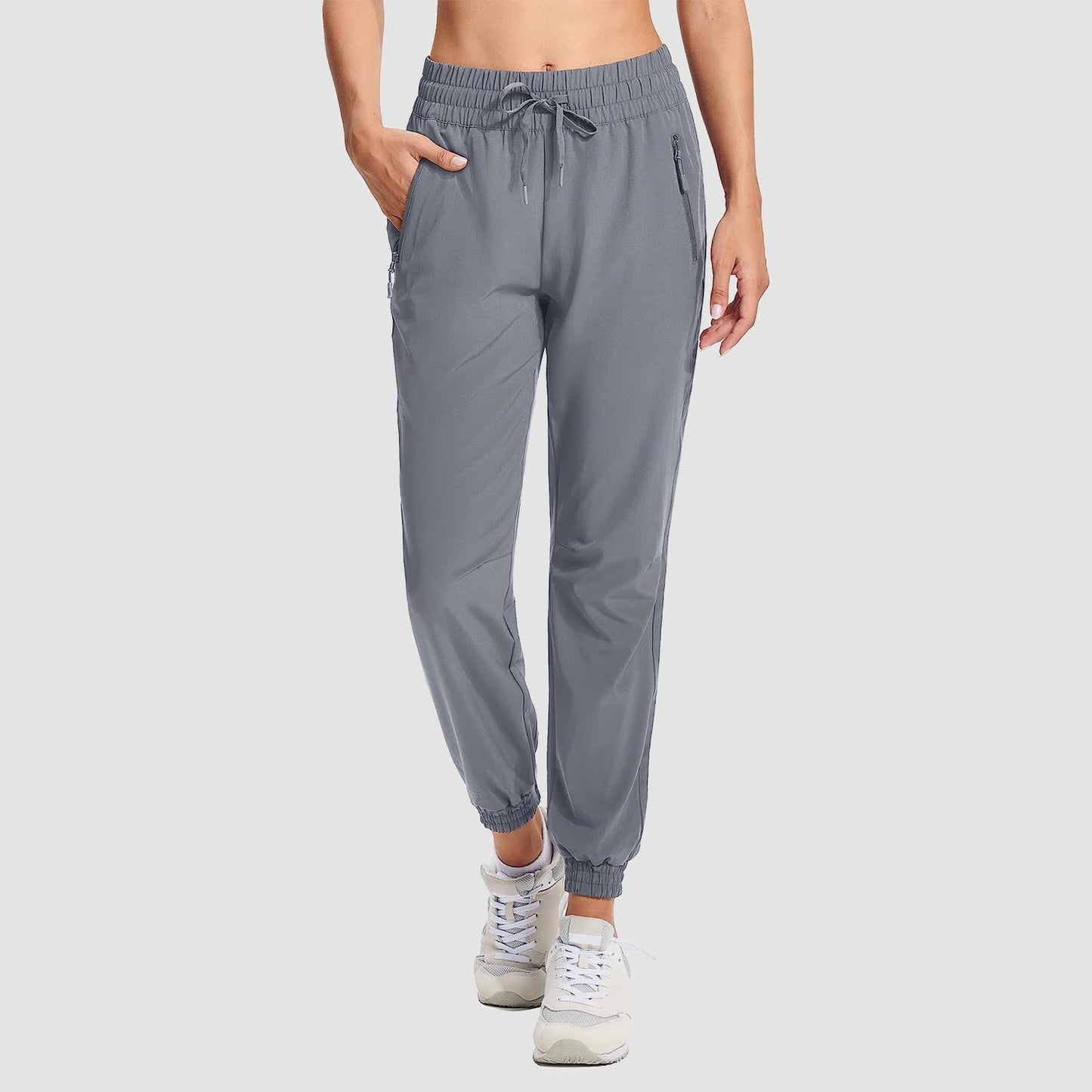 Women's lightweight gray hiking joggers with 4-way stretch, water-resistant fabric, and multiple pockets