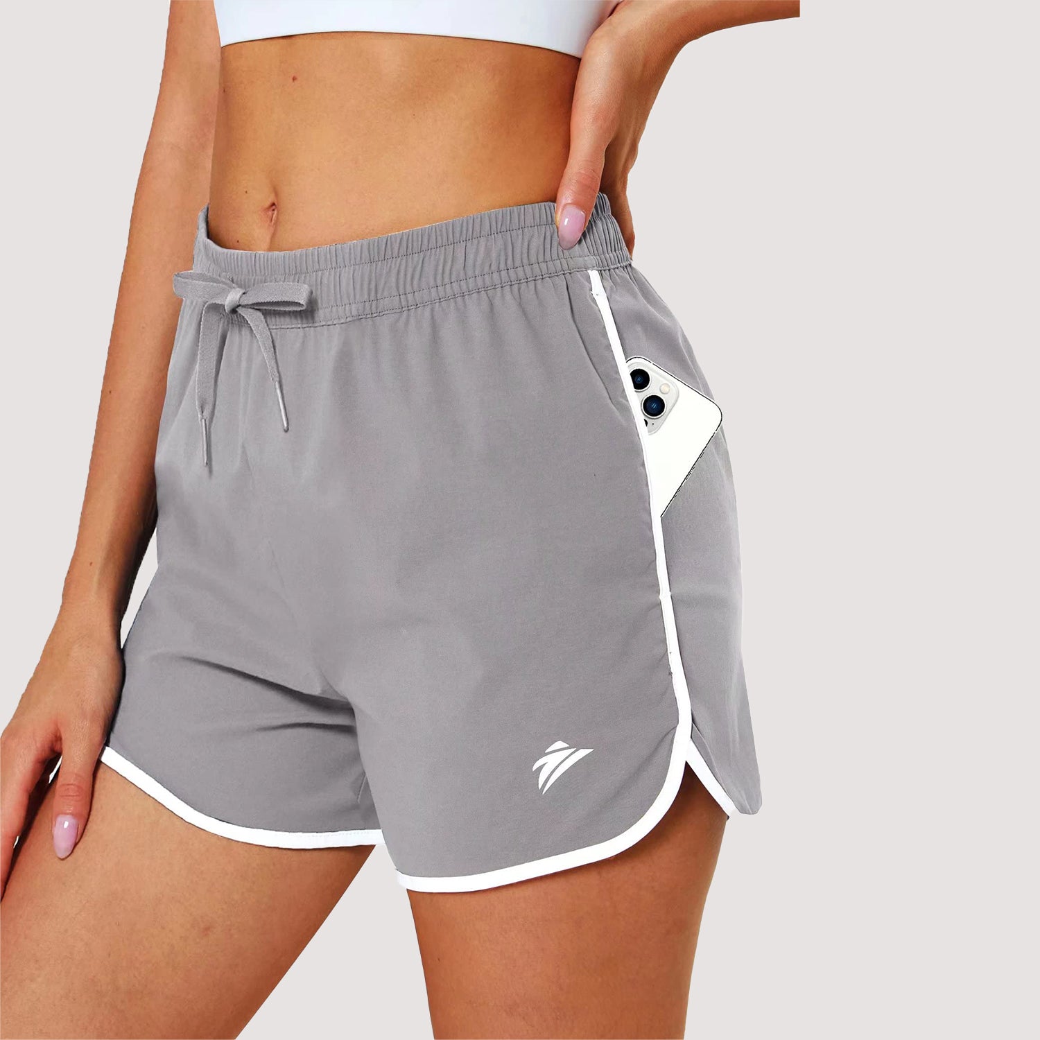 Women's athletic running shorts with 7-pocket design in quick-dry nylon-spandex blend for active training