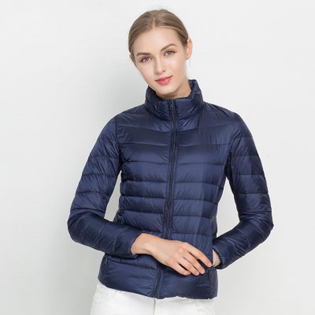 Women's black lightweight packable down jacket waterproof quilted silhouette for everyday outdoor wear