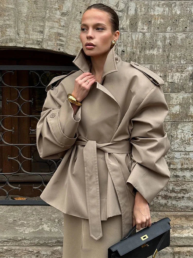 Beige cropped trench coat wide-shoulder silhouette belted waist modern tailored women's style