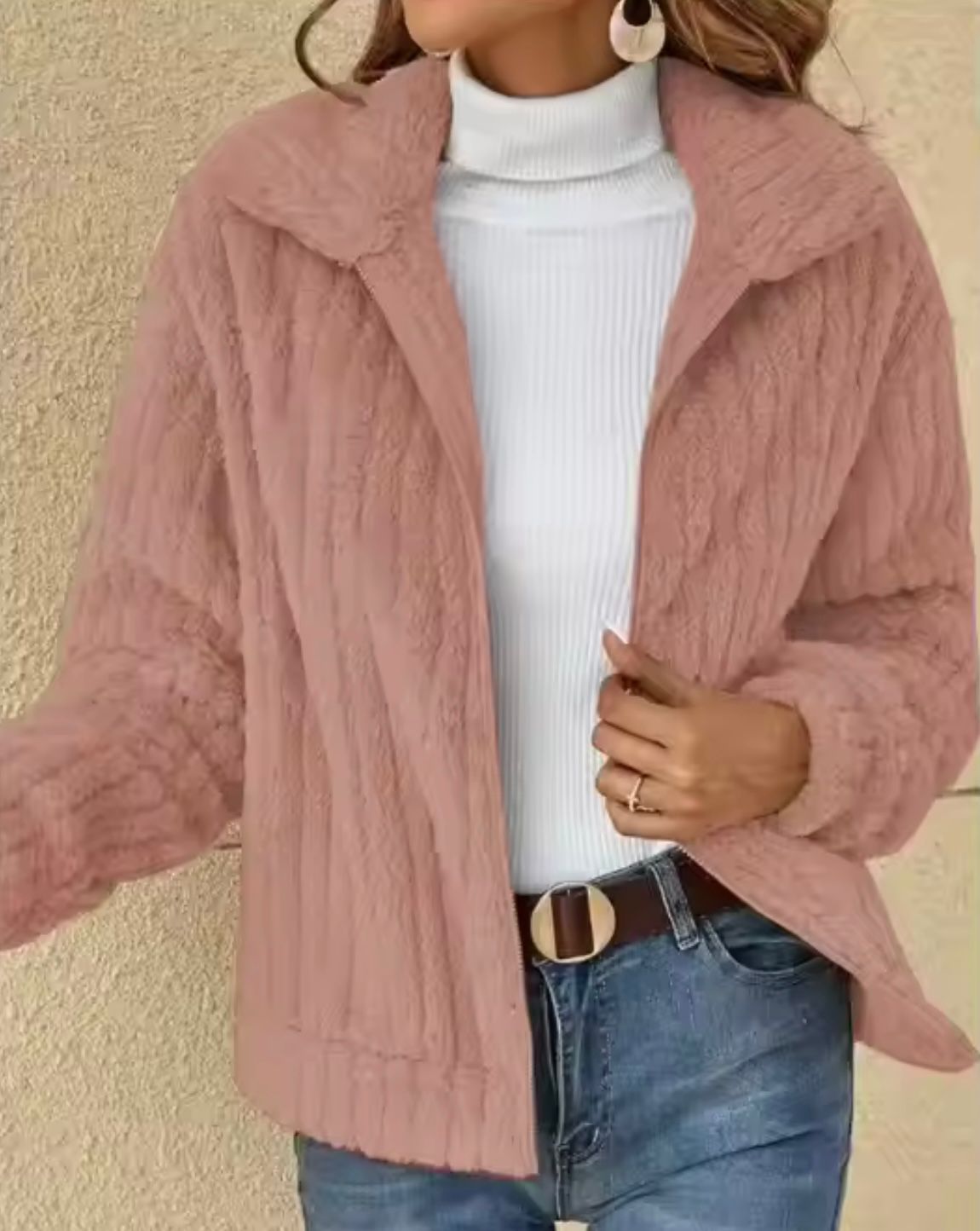 Beige faux fur cardigan jacket with plush texture, relaxed silhouette, and secure zip closure