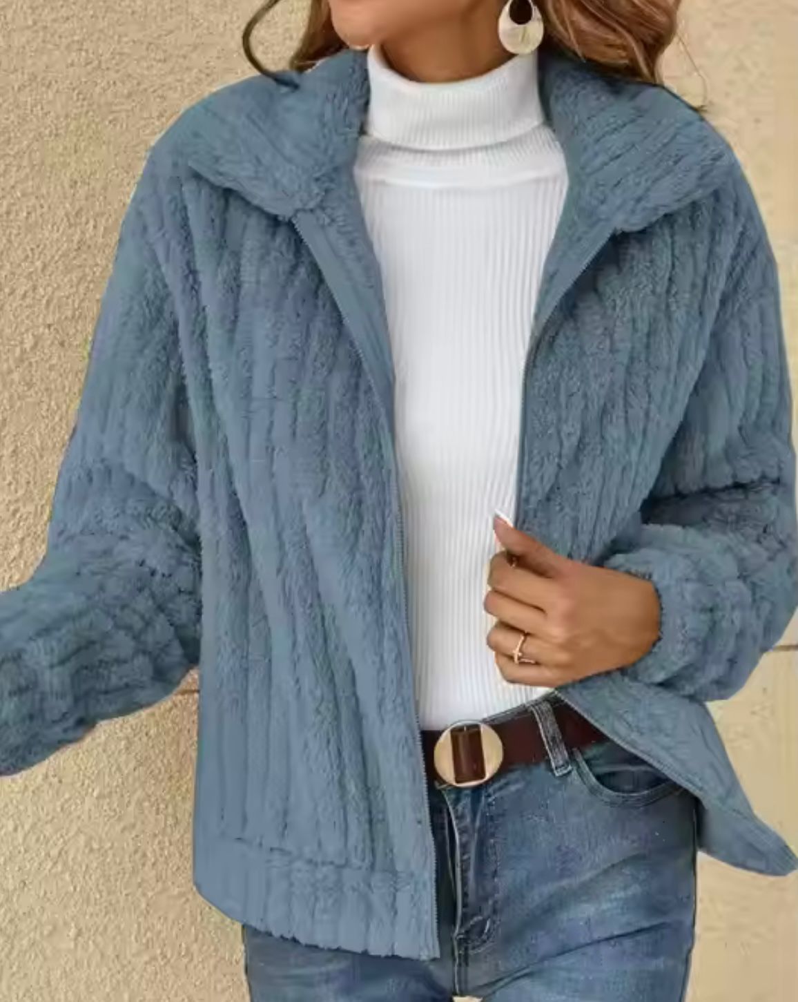 Beige faux fur cardigan jacket with plush texture, relaxed silhouette, and secure zip closure