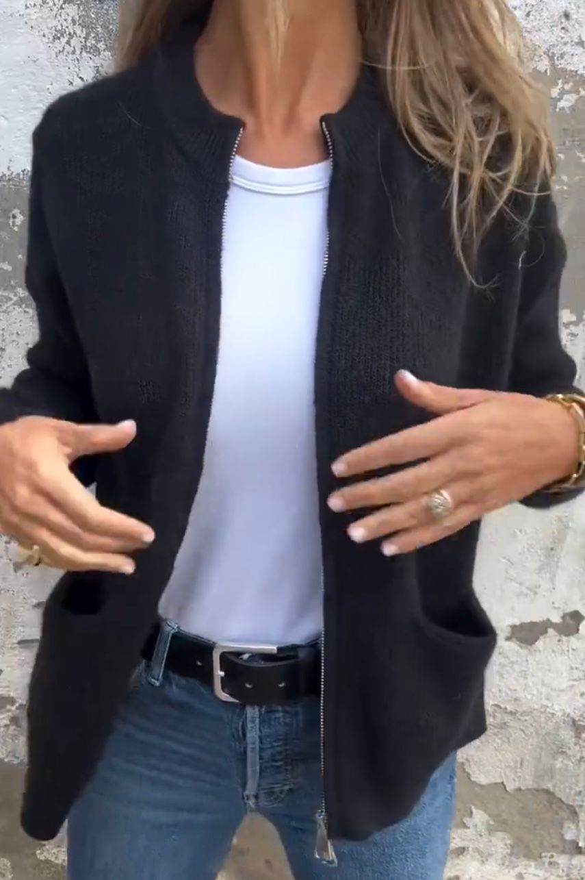 Women's light grey minimal knit cardigan with front pockets, relaxed everyday layering silhouette