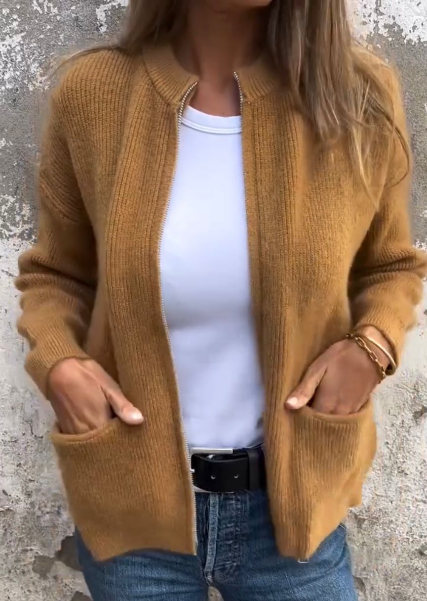 Women's light grey minimal knit cardigan with front pockets, relaxed everyday layering silhouette
