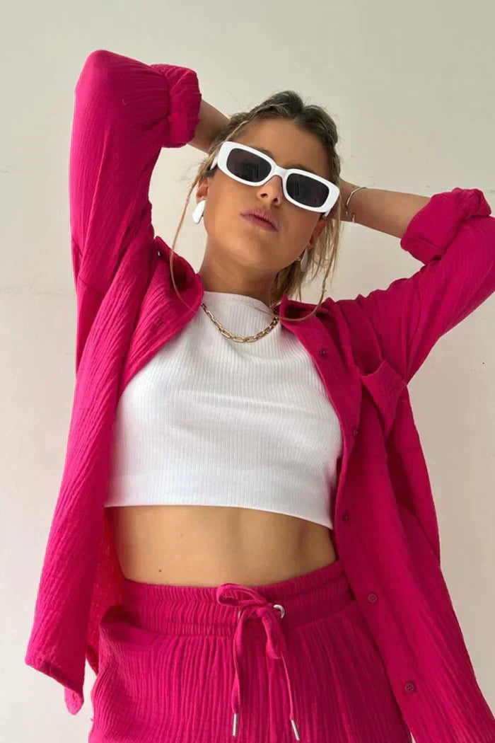 Bold color two-piece lounge set with button-up collared shirt and high-waist drawstring shorts