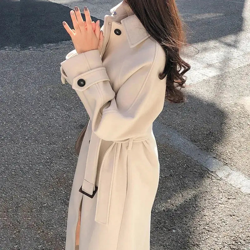 Women's long belted trench coat, warm elegant winter style with classic long-line silhouette