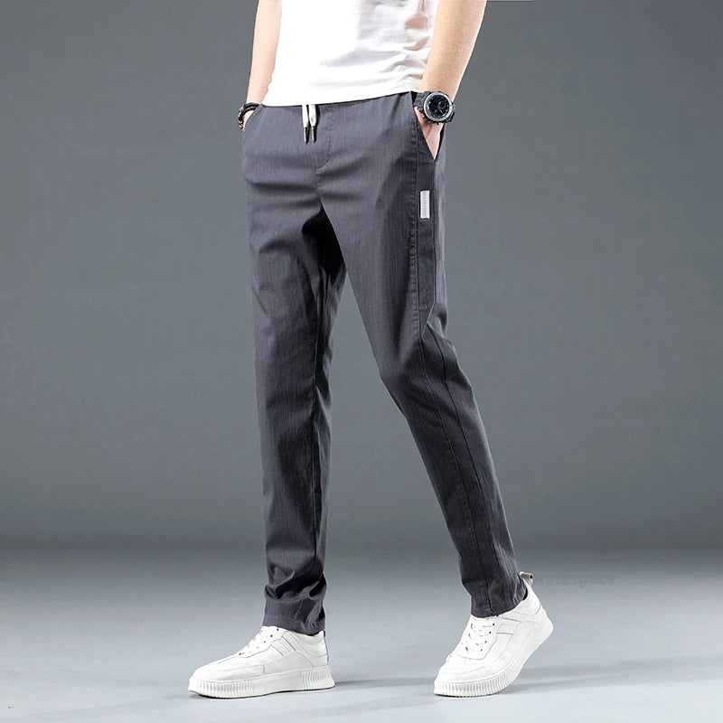 Men's slim fit stretch cotton pants with elastic waist, breathable fabric, and side pockets