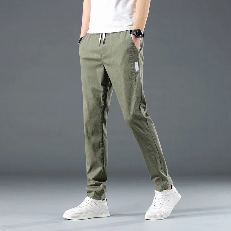 Men's slim fit stretch cotton pants with elastic waist, breathable fabric, and side pockets