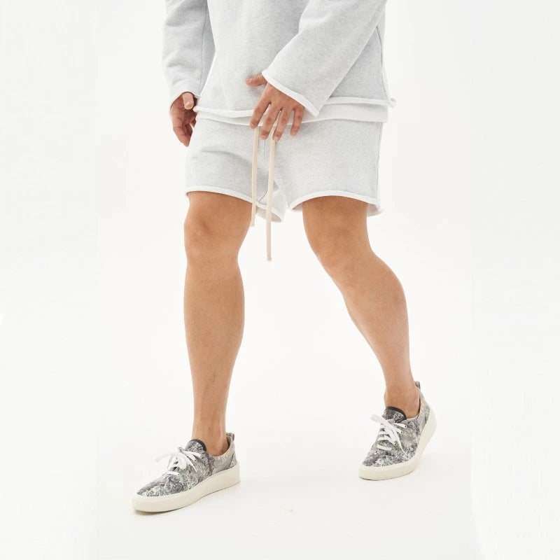 Unisex French terry lounge shorts in neutral tone, relaxed casual cut with adjustable drawstring waist