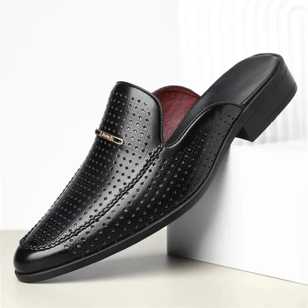 Women's tan leather slip-on mule with laser-cut perforations and backless design for all-day comfort