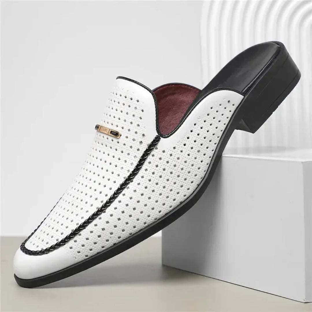 Women's tan leather slip-on mule with laser-cut perforations and backless design for all-day comfort