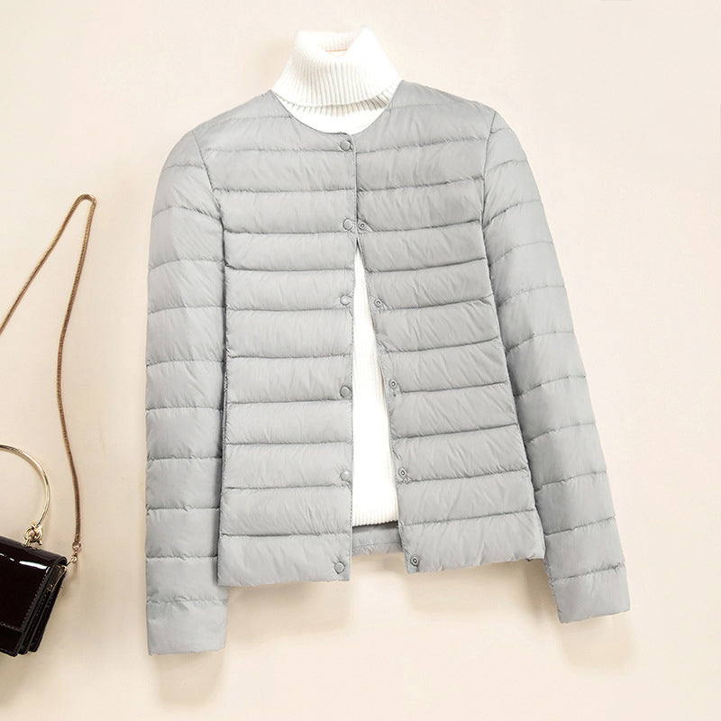 Women's lightweight quilted down jacket snap button closure refined warmth layering essential
