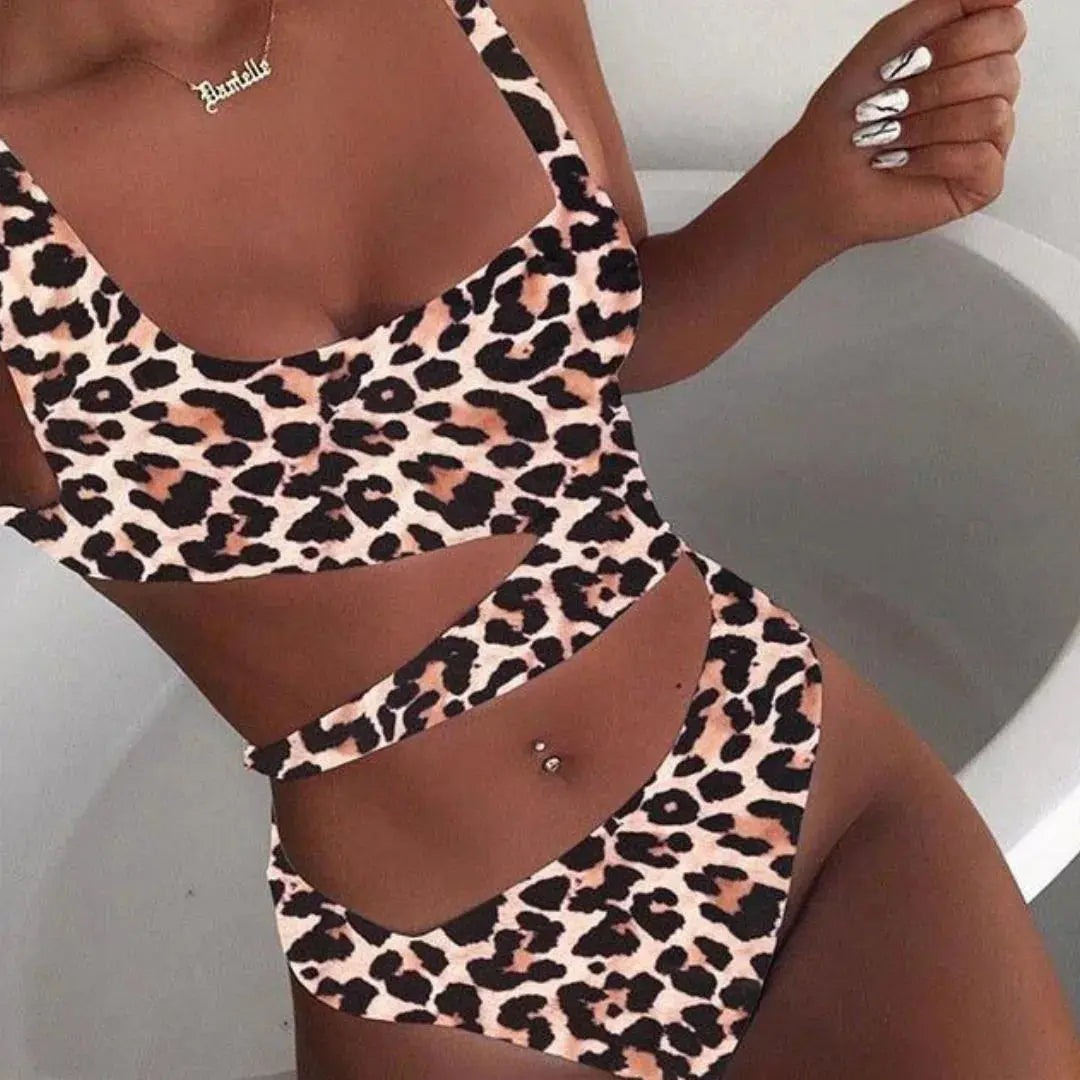 Black high-waisted one-piece swimsuit with bold side cut-outs for a sculpted silhouette