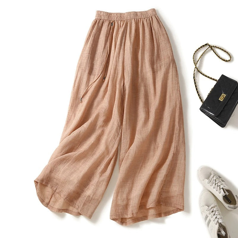 Women's white wide-leg linen pants with elastic drawstring waist, airy relaxed summer fit