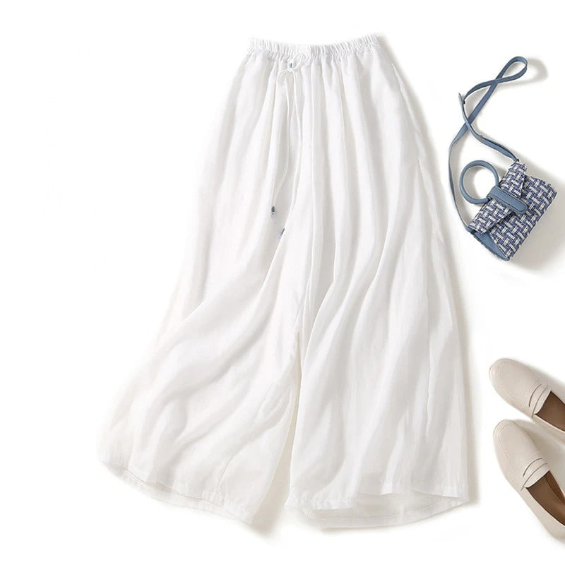 Women's wide-leg linen pants in natural beige with elastic drawstring waist, airy summer silhouette