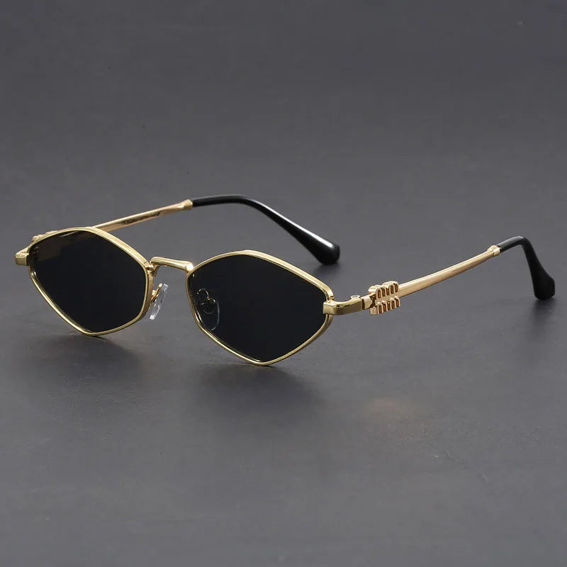 Gold-tone cat-eye microframe sunglasses with dark UV lenses, slim angular silhouette for bold style