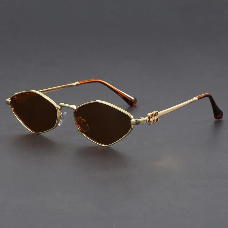 Gold-tone cat-eye microframe sunglasses with dark UV lenses, slim angular silhouette for bold style