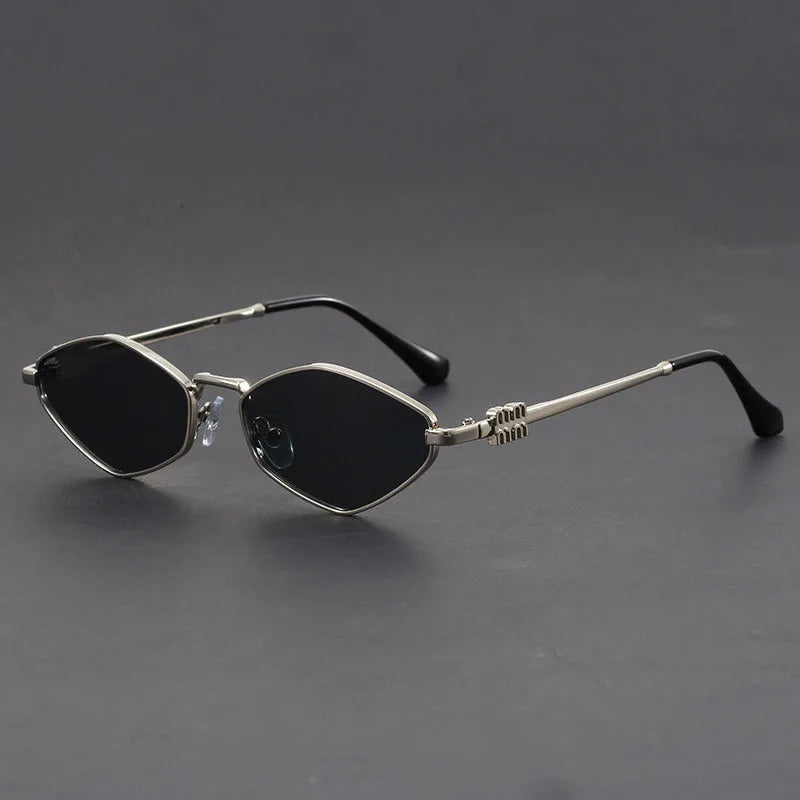 Gold-tone cat-eye microframe sunglasses with dark UV lenses, slim angular silhouette for bold fashion