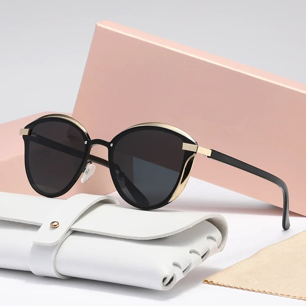 Women's black cat-eye sunglasses with UV400 lenses, gold accent finish, lightweight metal frame
