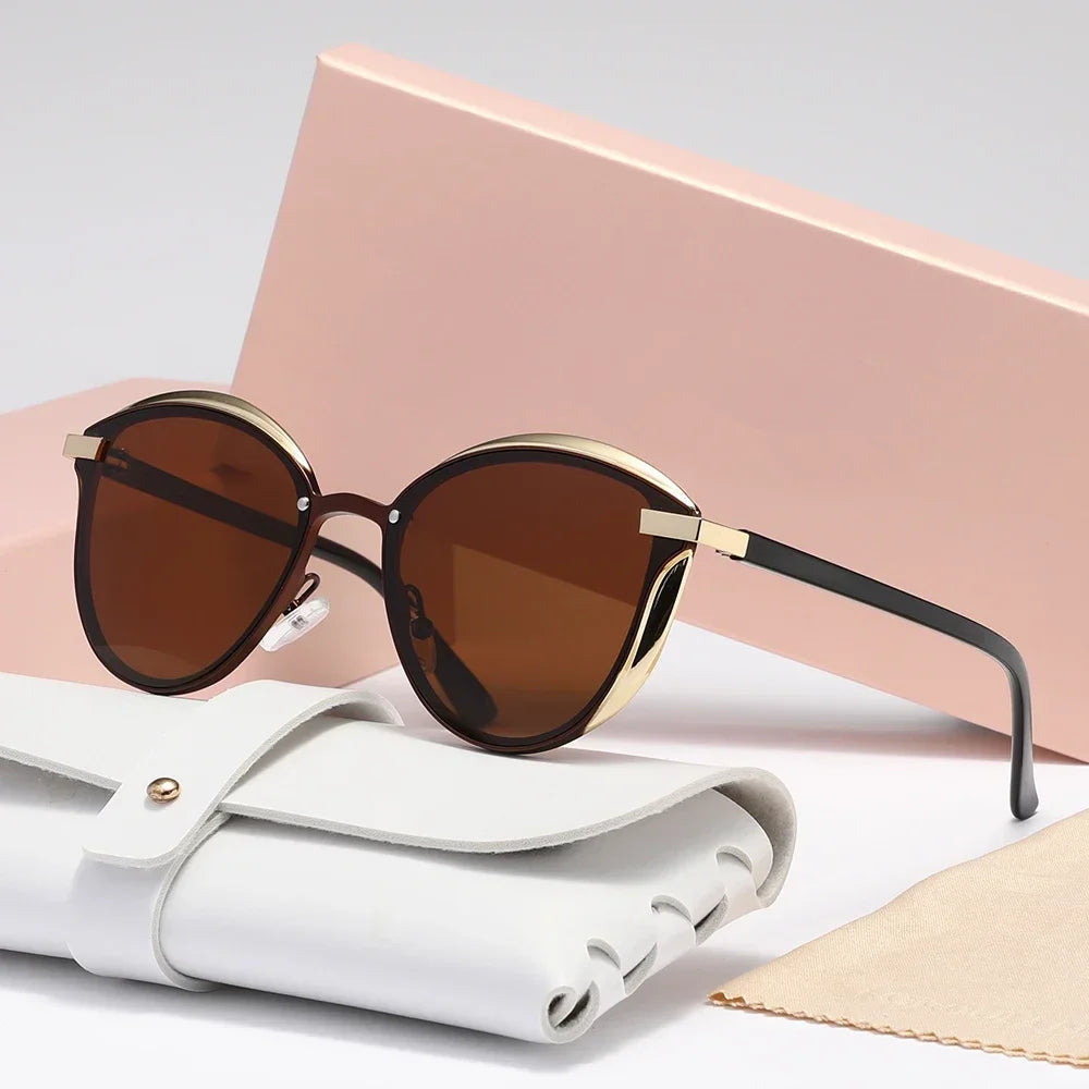 Women's cat-eye sunglasses with UV400 lenses, gold accent finish, lightweight metal frame, elegant luxe style