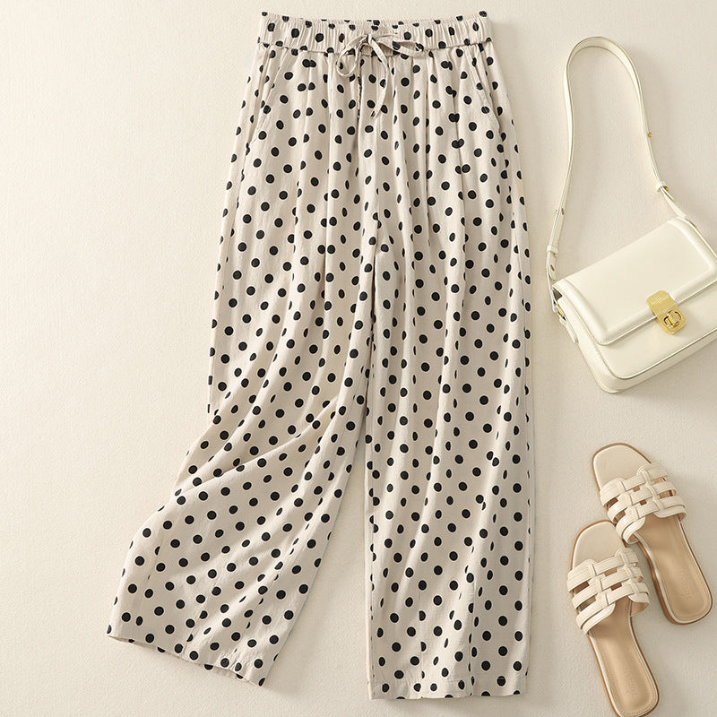 Women's lightweight flowy polka dot pants with elastic drawstring waist and graceful draping silhouette