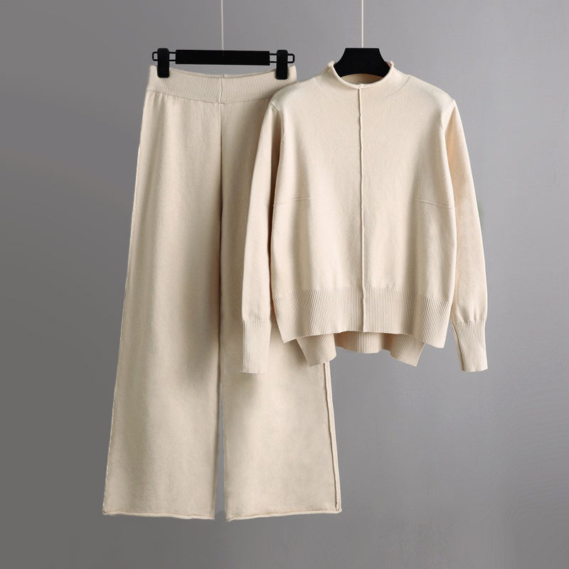 Women's beige knit lounge set with flowing wide-leg pants and half turtleneck cozy sweater