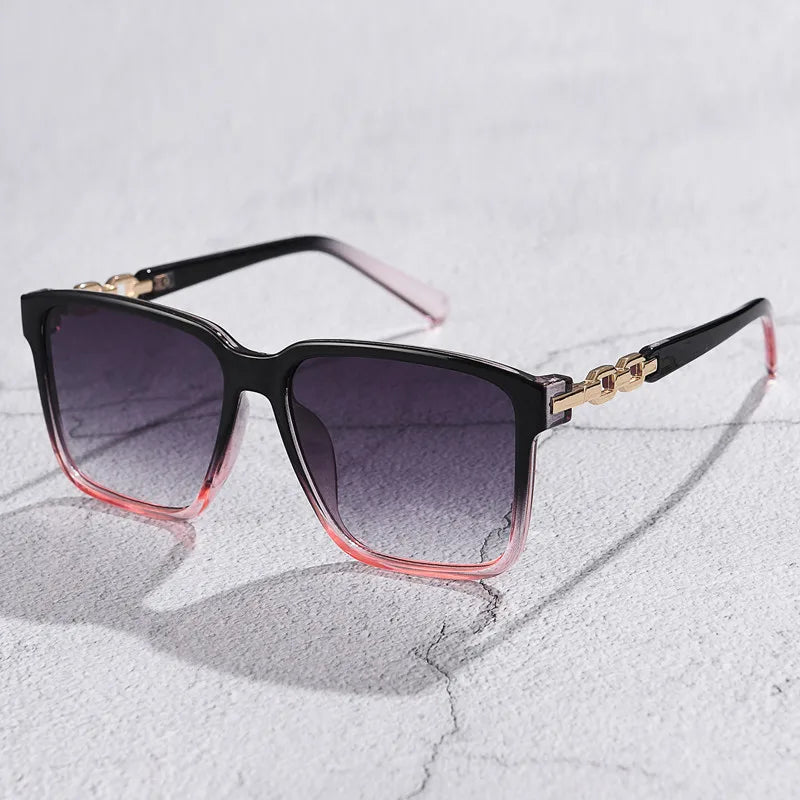 Square gradient lens sunglasses with gold chain accent arms, retro-glam style for women