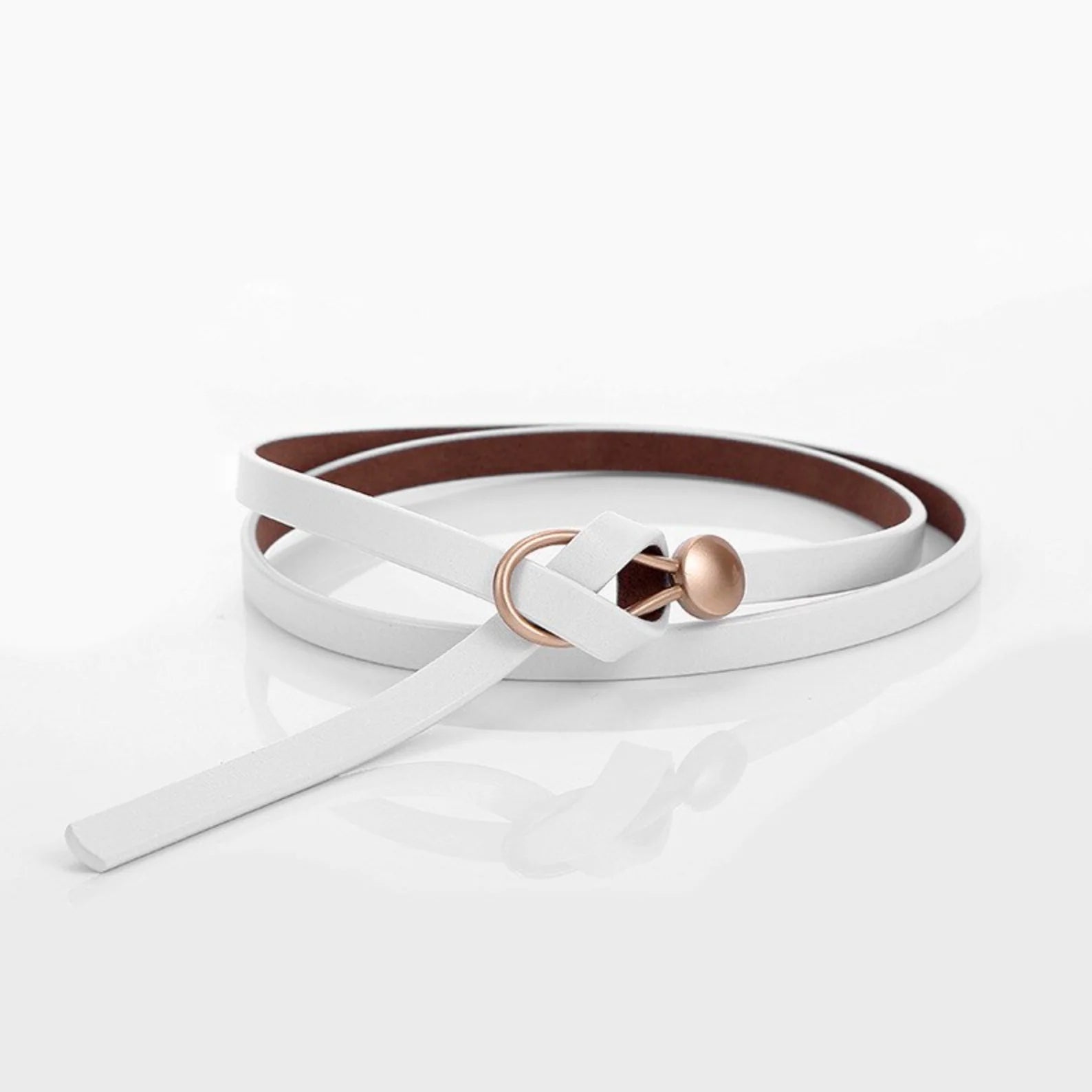 Women's slim brown leather belt with gold-toned buckle, narrow waist-cinching design for everyday style