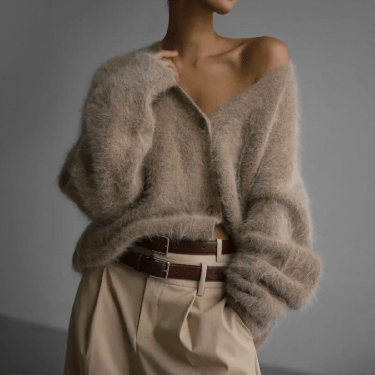 Women's fluffy oversized cardigan deep V-neck plush knit relaxed silhouette cozy layering piece