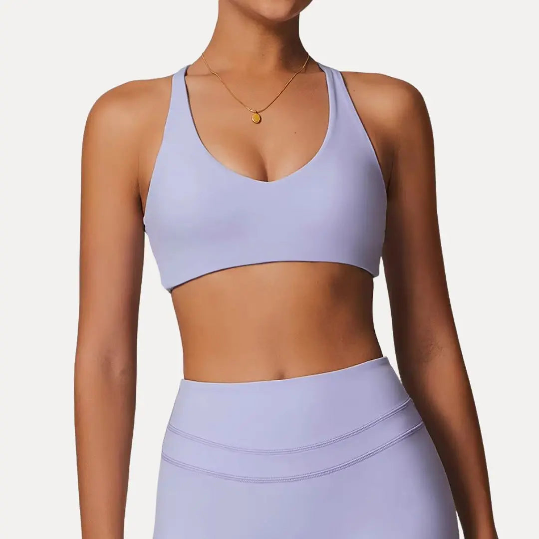 Lyra light support sports bra with adjustable crisscross back straps, breathable minimalist fit for women