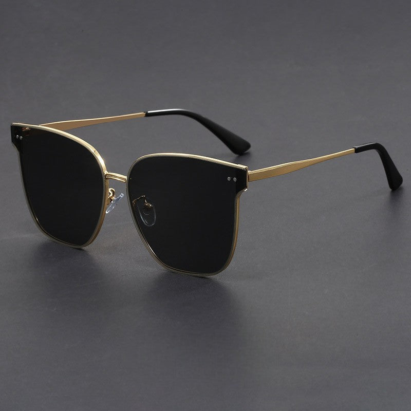 Lightweight cat-eye sunglasses gold tone frame UV protection sleek modern silhouette for women