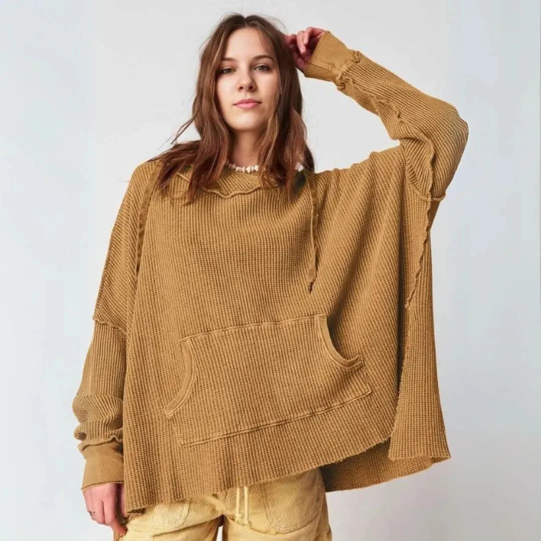 Women's oversized waffle knit hoodie in cozy relaxed fit with kangaroo pocket and adjustable neckline