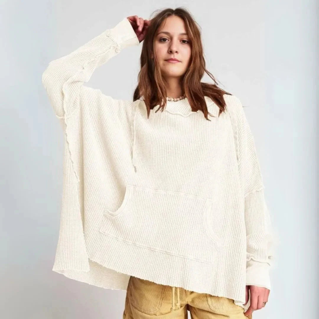 Women's oversized waffle knit hoodie in cozy relaxed fit with kangaroo pocket and adjustable neckline