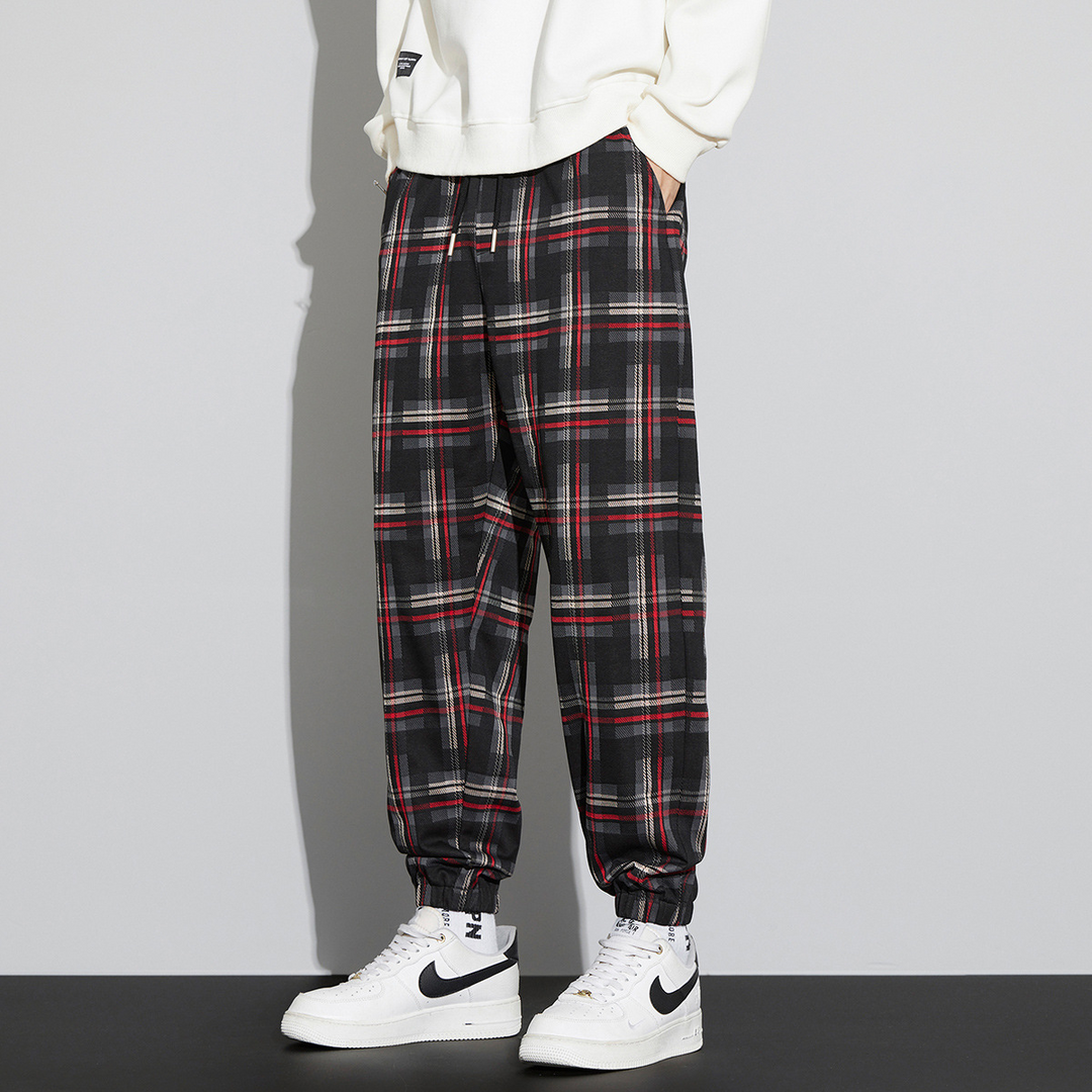 Men's relaxed fit plaid check joggers with elastic cuffs and drawcord waist in classic tartan pattern