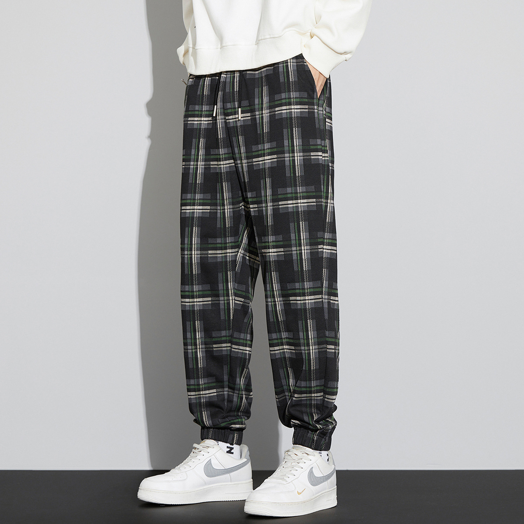 Men's relaxed fit plaid check joggers with elastic cuffs and drawcord waist in classic tartan pattern