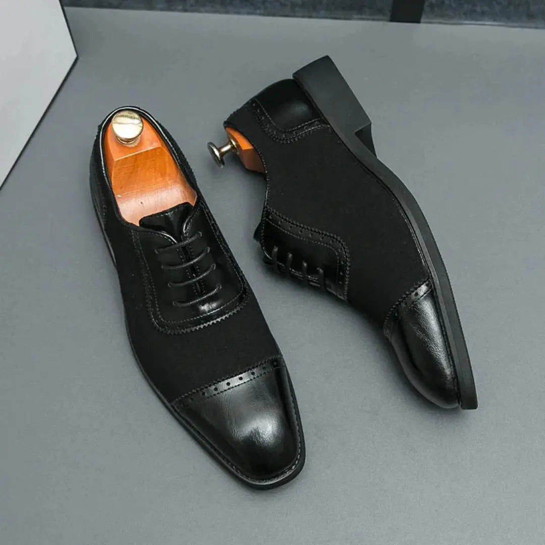 Black Oxford dress shoes with black-on-black lace detail and slip-resistant sole for professionals