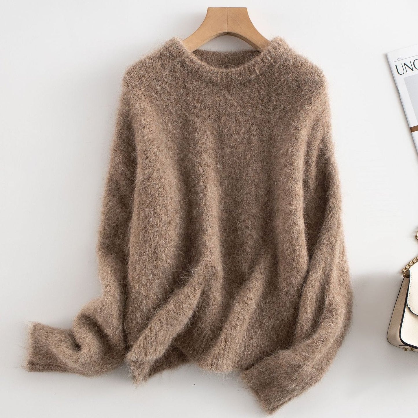 Women's relaxed fit ribbed wool sweater in neutral tone, cozy casual style with textured knit detail