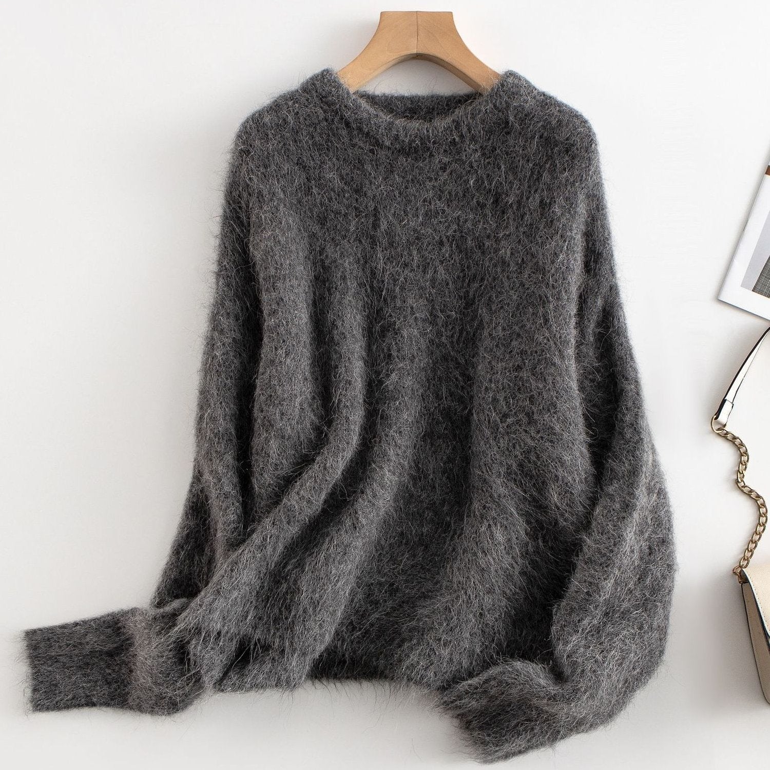 Women's relaxed fit ribbed wool sweater in neutral tone, cozy casual style with textured knit detail
